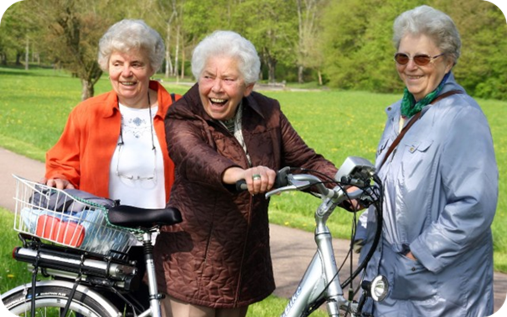 Lachende dames met fiets